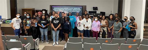 Oakwood Students standing in the front of the room with Keith Rogers smiling at the camera.
